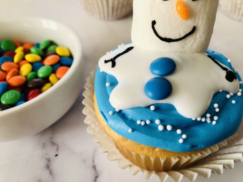 Melted snowman cupcake with buttons