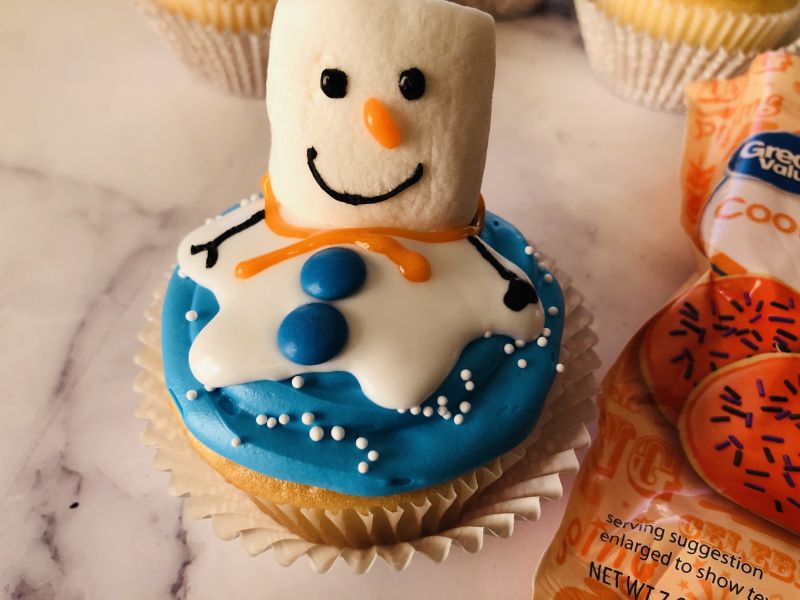 Melted snowman cupcake with scarf