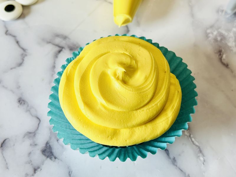 yellow frosted cupcake